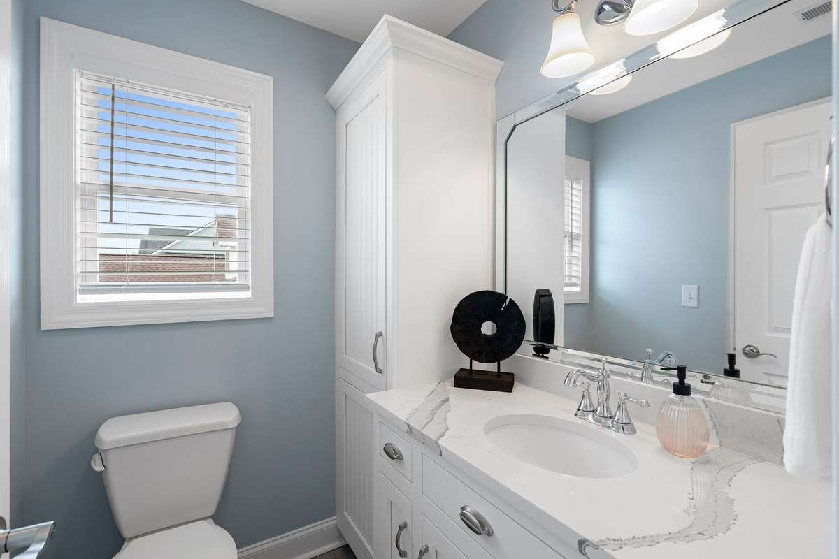 Here is the private toilet/vanity areas accessible via Bedroom 3. Notice the linen tower for additional storage space!