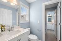 This photo provides a view of the private toilet/vanity space accessible to Bedroom 2...