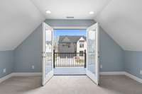 Lovely French Doors just off the Primary Bedroom lead to a private balcony -- how very special!