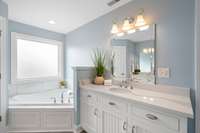 The corner Jacuzzi tub is a perfect ending to a long day...