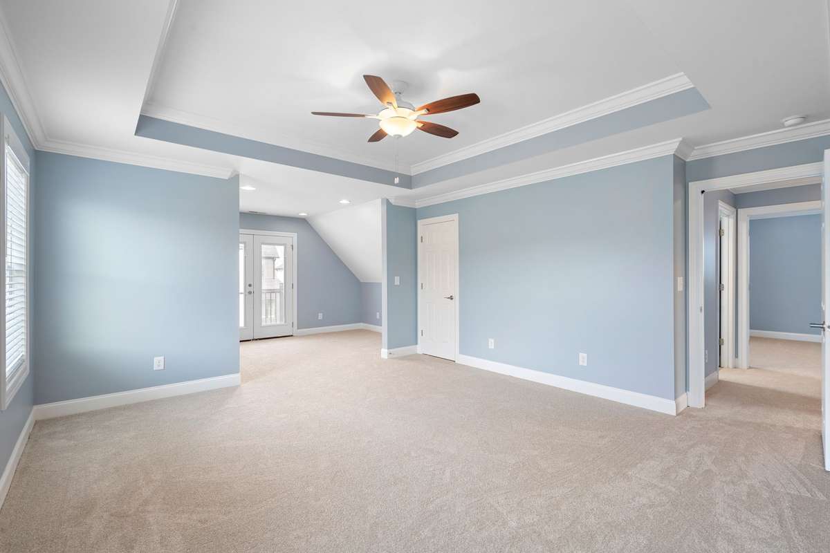 Another view of the Primary Bedroom -- notice the tray ceiling as well!