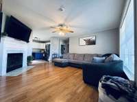 Spacious living room with natural lighting and fireplace