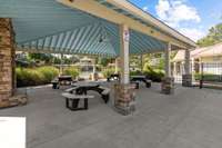 Enormous covered pavilion with seating and outdoor fireplace