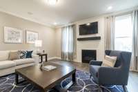 Great room*Photos are of a model home of a similar floorplan. Actual colors, structural selections, and finishes may vary.