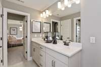 Photos are of the model home. Listing is for a to be built home.  Double sinks in secondary Bathroom!