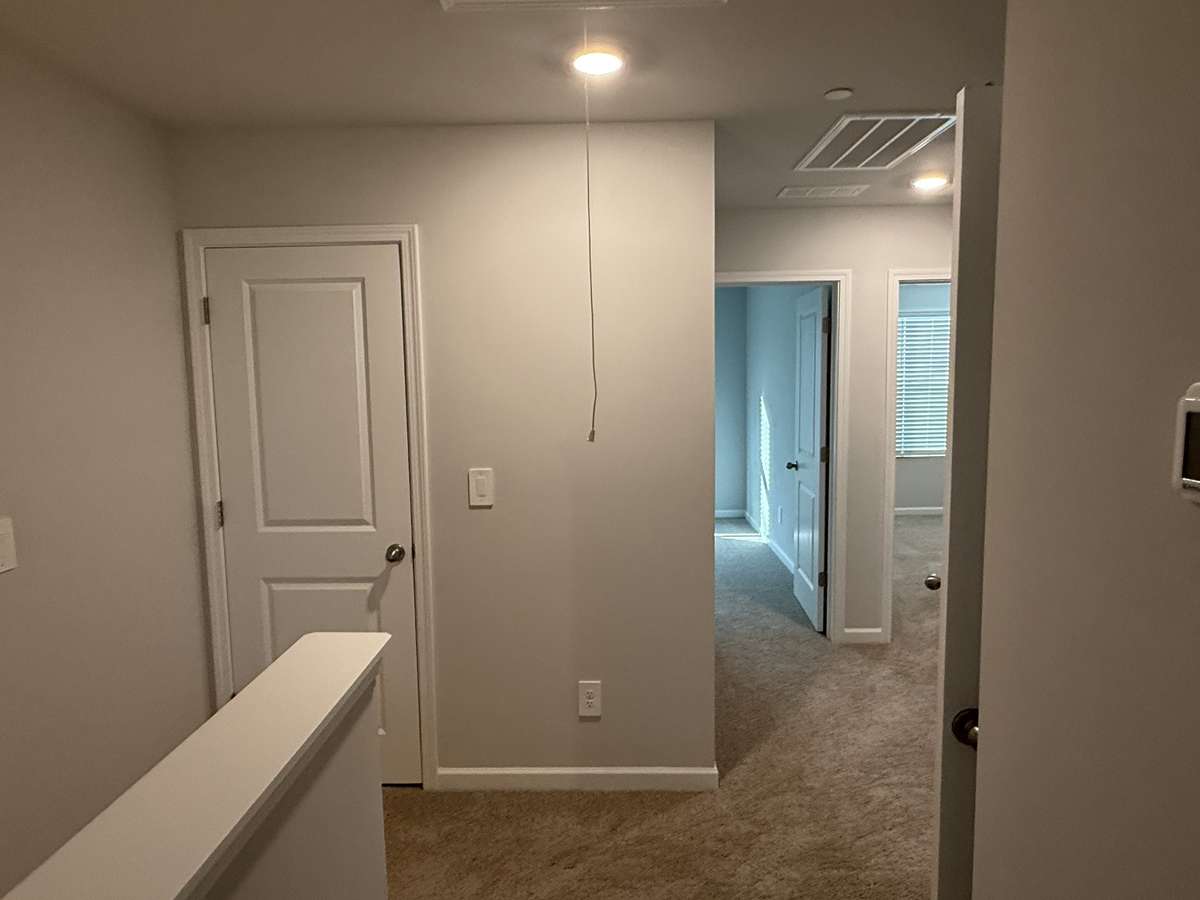 Upstairs hallway looking toward secondary bedrooms