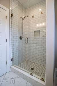 Spa like tile shower with glass door! Gorgeous!