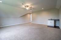 Huge bonus room boasting wet bar with no staging