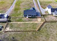 Seller had property resurveyed and added to lot for more usable back yard!