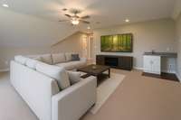 Huge bonus room boasting wet bar with virtual staging! So pretty!