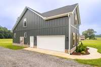 Spacious two car garage with pedestrian door and tons of space for driveway parking