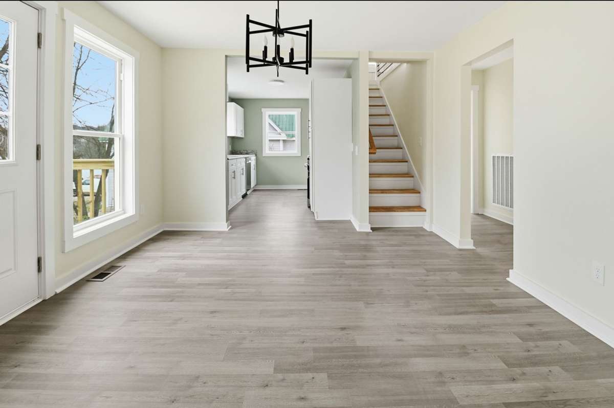 Plenty of space for a formal dining suite or farmhouse seating. Convenient to the kitchen and grilling deck on the side, Sunday dinners or Football Fridays are easy to imagine here!