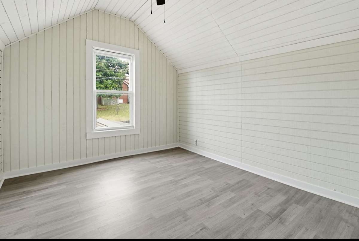 The 3rd bedroom with original shiplap! This upstairs bedroom would be great for the teen that wants his/her privacy. So many ways to use this space & the room size welcomes many layouts for furniture.
