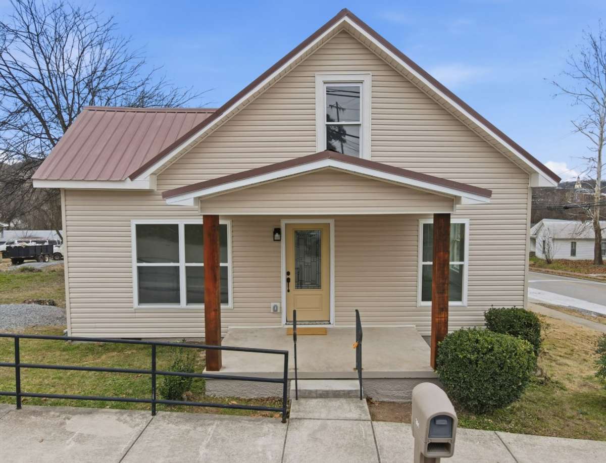 Simple yet sophisticated! The curb appeal of solid cedar posts with a porch made for a swing and rocking chair welcomes everyone!