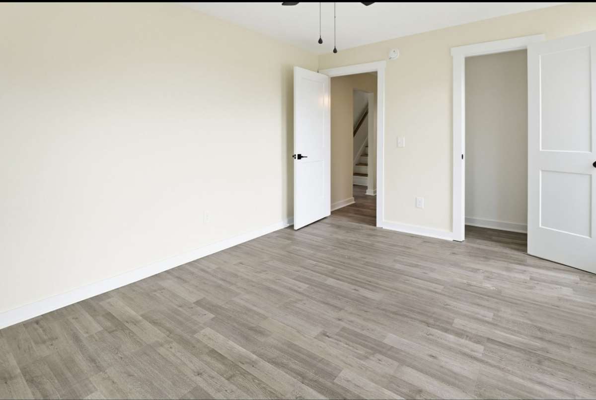 All through this home is Luxury Vinyl Plank flooring. This primary bedroom is large enough for a king set!