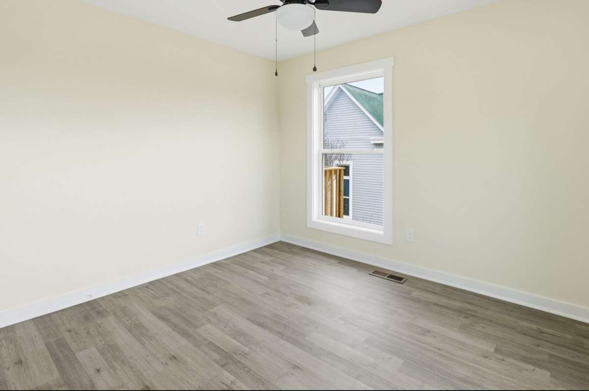 The 2nd bedroom on the main level has 3 windows (2 not shown). Easily with enough space for queen bedding, this room is very accommodating for family or guests.