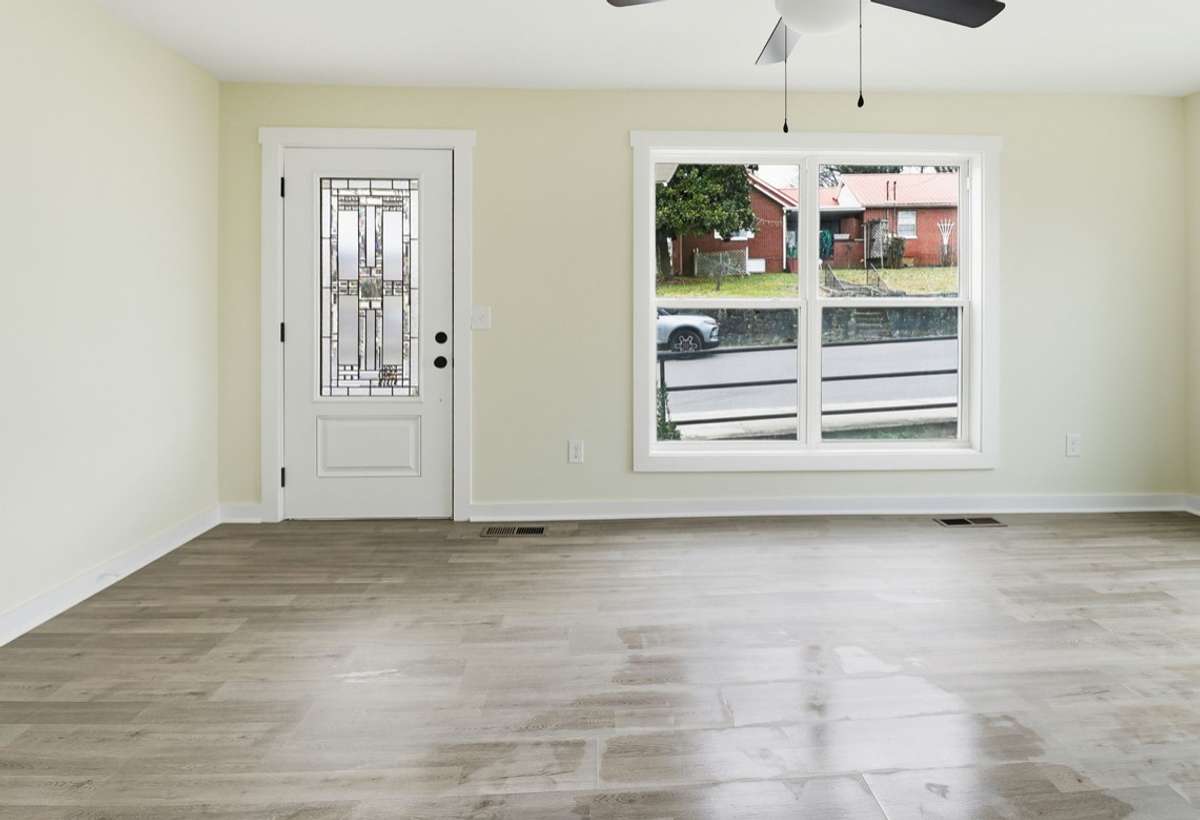 Double windows on each side of this living room where natural light welcomes you. A great size living room with multiple possibilities for furniture layout. (This pic shows only half of the entire room.)