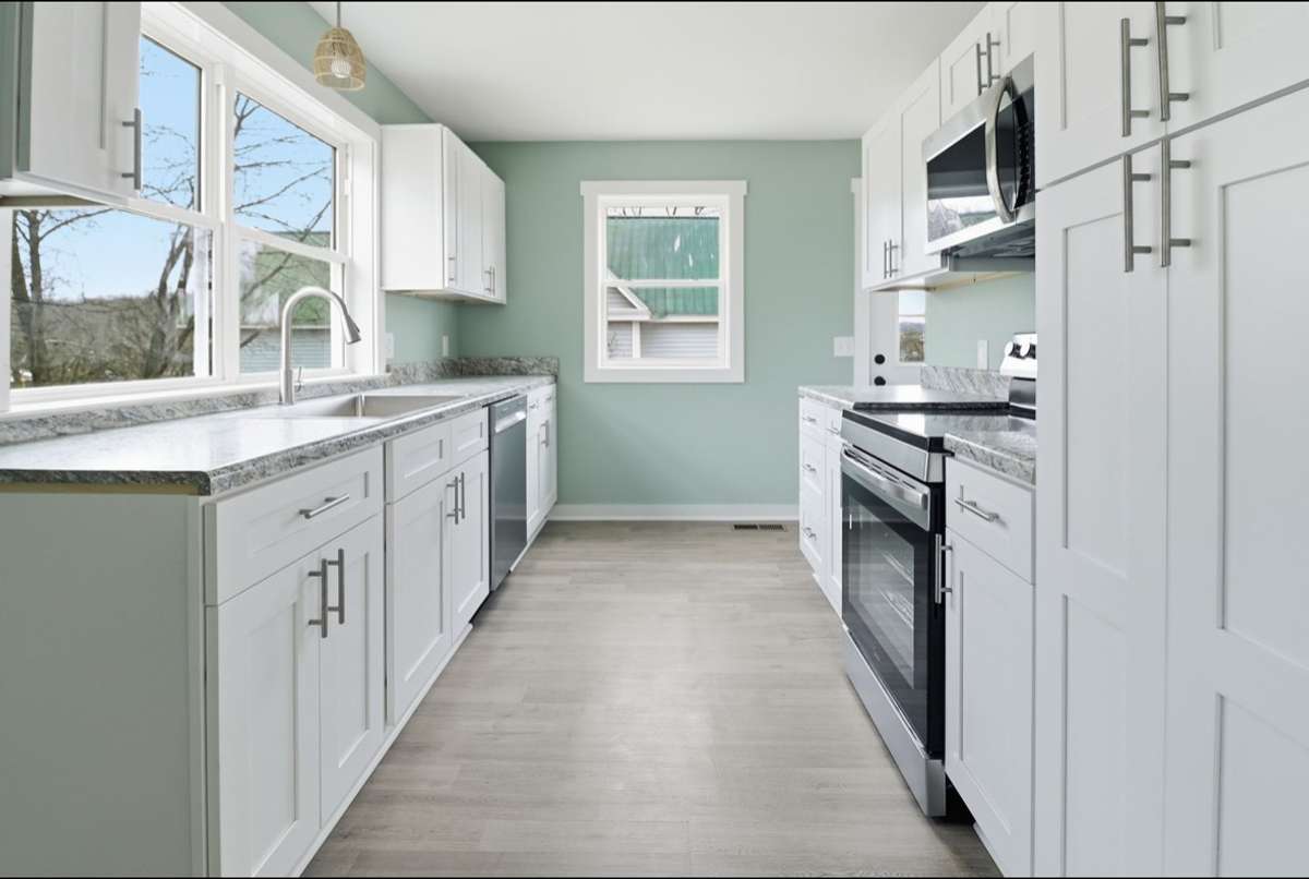 A kitchen for a Chef! Easy access to all the essentials! Equipped with a stainless open well sink, double pantry, new stainless appliances, and Bertch soft close cabinetry, you can rest assured this new kitchen will make cooking easy.