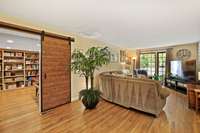 Barn door Could be removed and entryway walled off to configure back into a traditional duplex