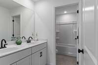 Secondary upstairs bathroom
(photos are of a staged model home)