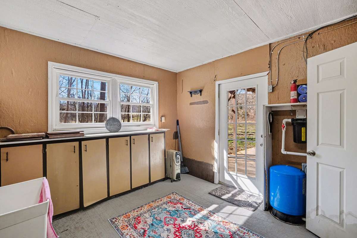 Large laundry room with tons of natural light beaming through!
