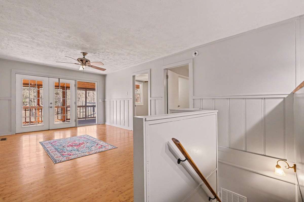 Come upstairs to the main level with open concept living, dining, and kitchen.