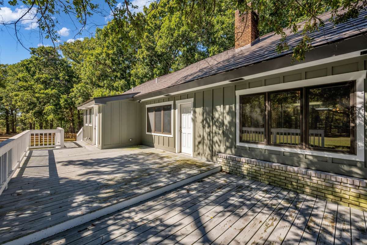 Side view with Deck & Entrance to Living room and Laundry room