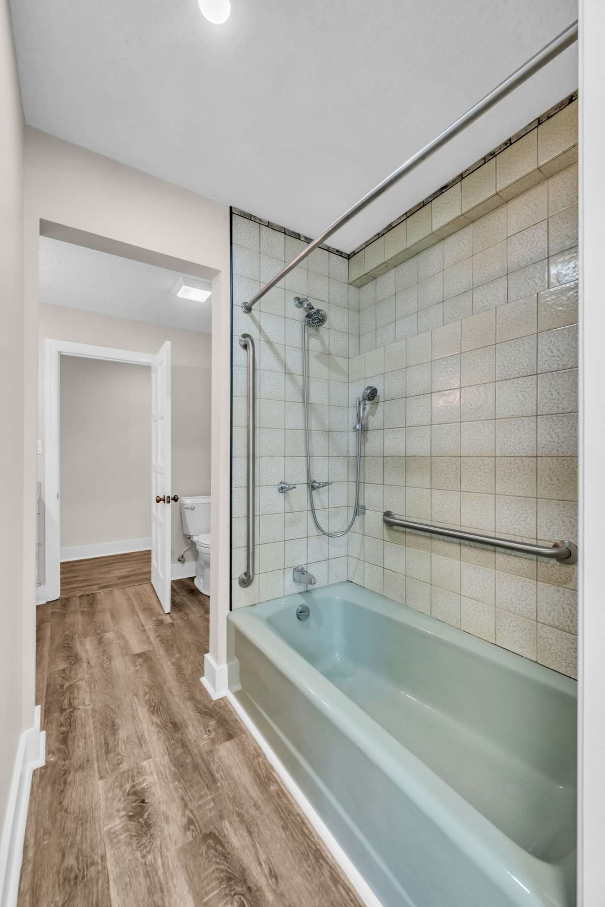 Hall Bath with Tile Surround and Soak Tub