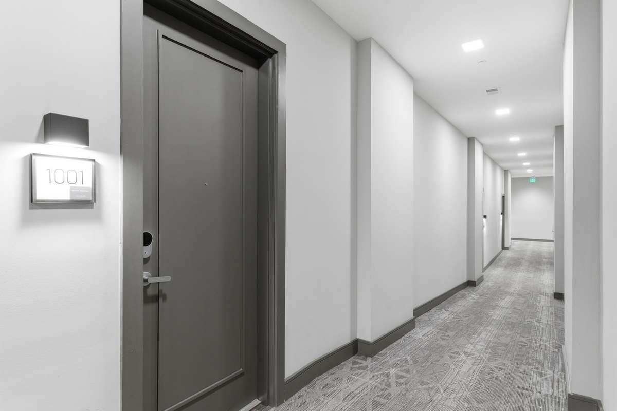 Two entry ways to this unit, this is the interior hallway leading to common areas, mail room, and garage / rooftop areas.