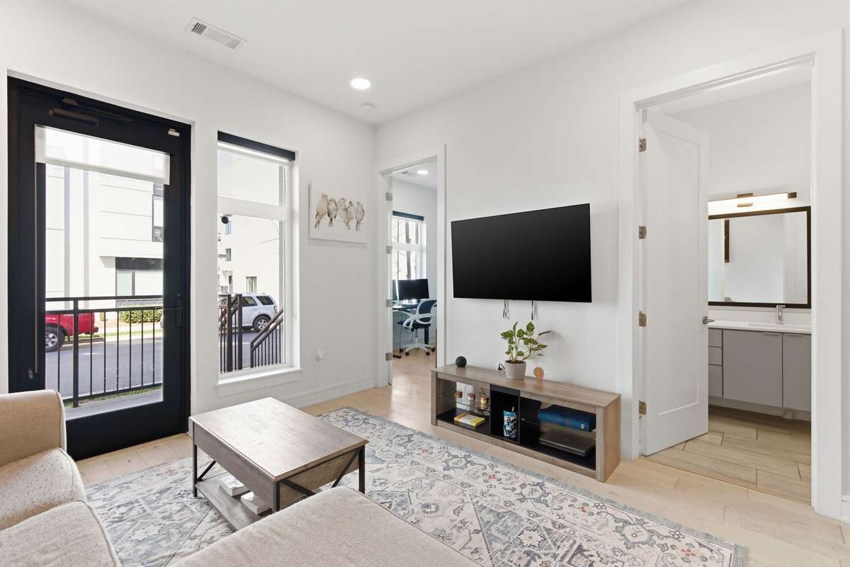 Living area access to bedroom and bath. Tall windows for better natural lighting.