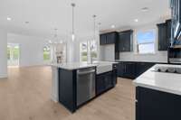 Stunning navy cabinets really pop in this sun lit space!