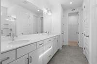 Primary en suite with double vanities.