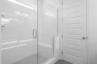 Frameless glass on the oversized shower.