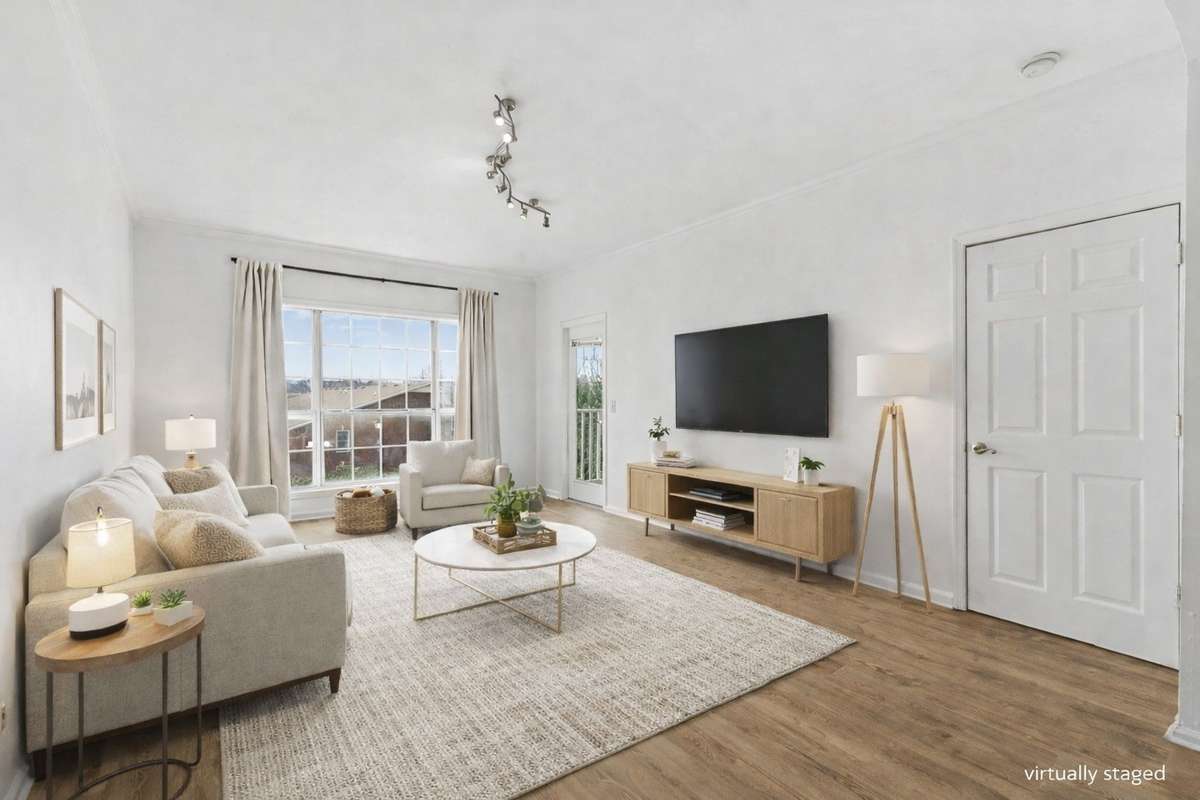 Beautiful, large living room with large windows with hill views 
*virtually staged*