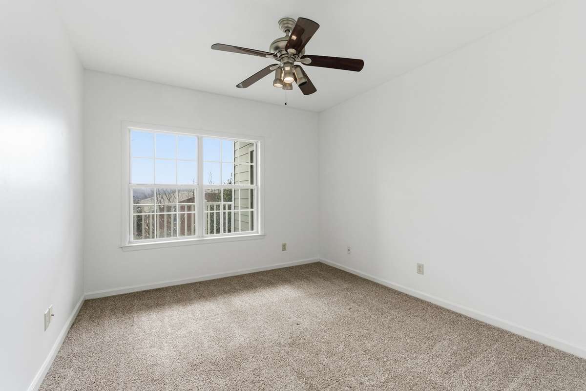 Great primary bedroom with great views of the balcony