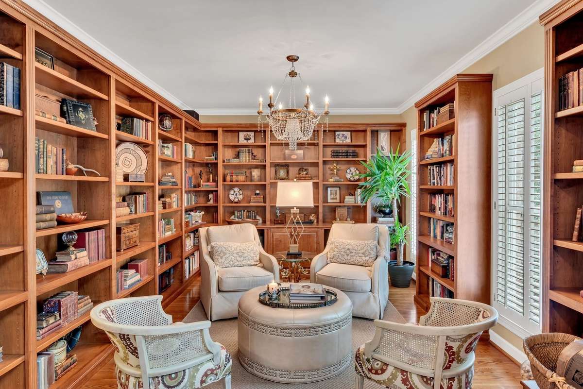 The private study is ensconced by custom built-in bookcases.