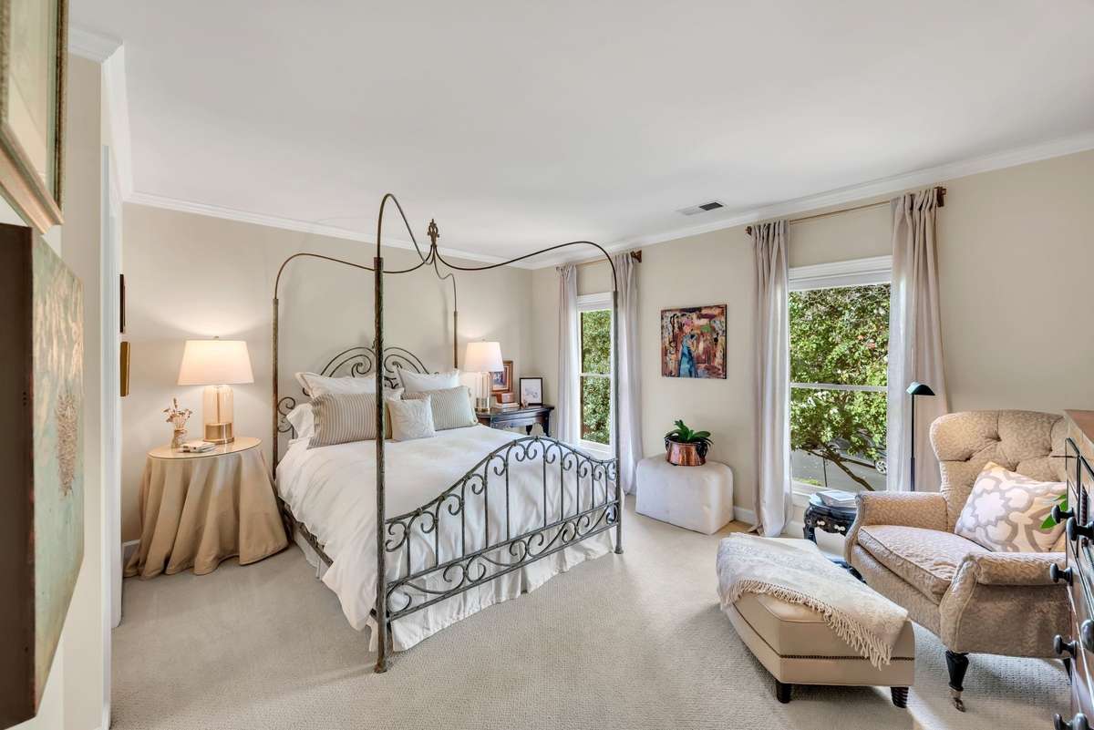 Spacious bedroom 2 has multiple closets, including a walk-in closet, and an updated full bathroom.