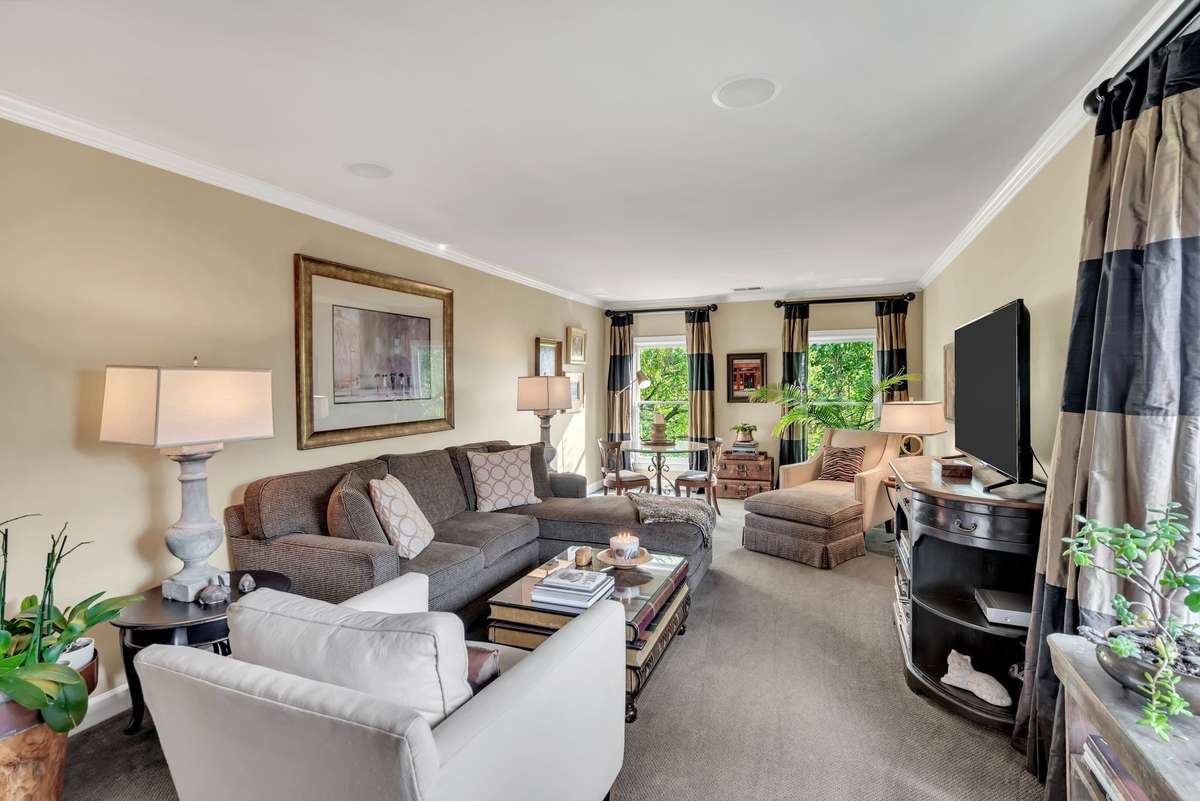 The versatile second-floor 5th bedroom, being used as a bonus room, has a large closet & convenient access to the updated, full bathroom with a double vanity.
