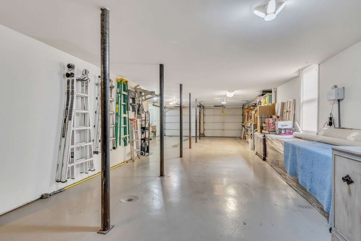 The 2000 sf basement has 1000 sf of flex space, a portion is heated & cooled, with water supply, drain, and vent pipe. Direct access to the driveway, via french doors, makes it well-suited for an apartment build-out. The garage accommodates 3 cars.