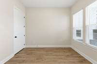 Office off the foyer with windows off the front for a lot of natural light plus a hall closet