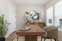 The front flex room is staged in this picture to show office furniture as a possible choice in this room.