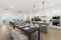 This picture is staged to show your possible furniture placement in this beautiful Magnolia floorplan.