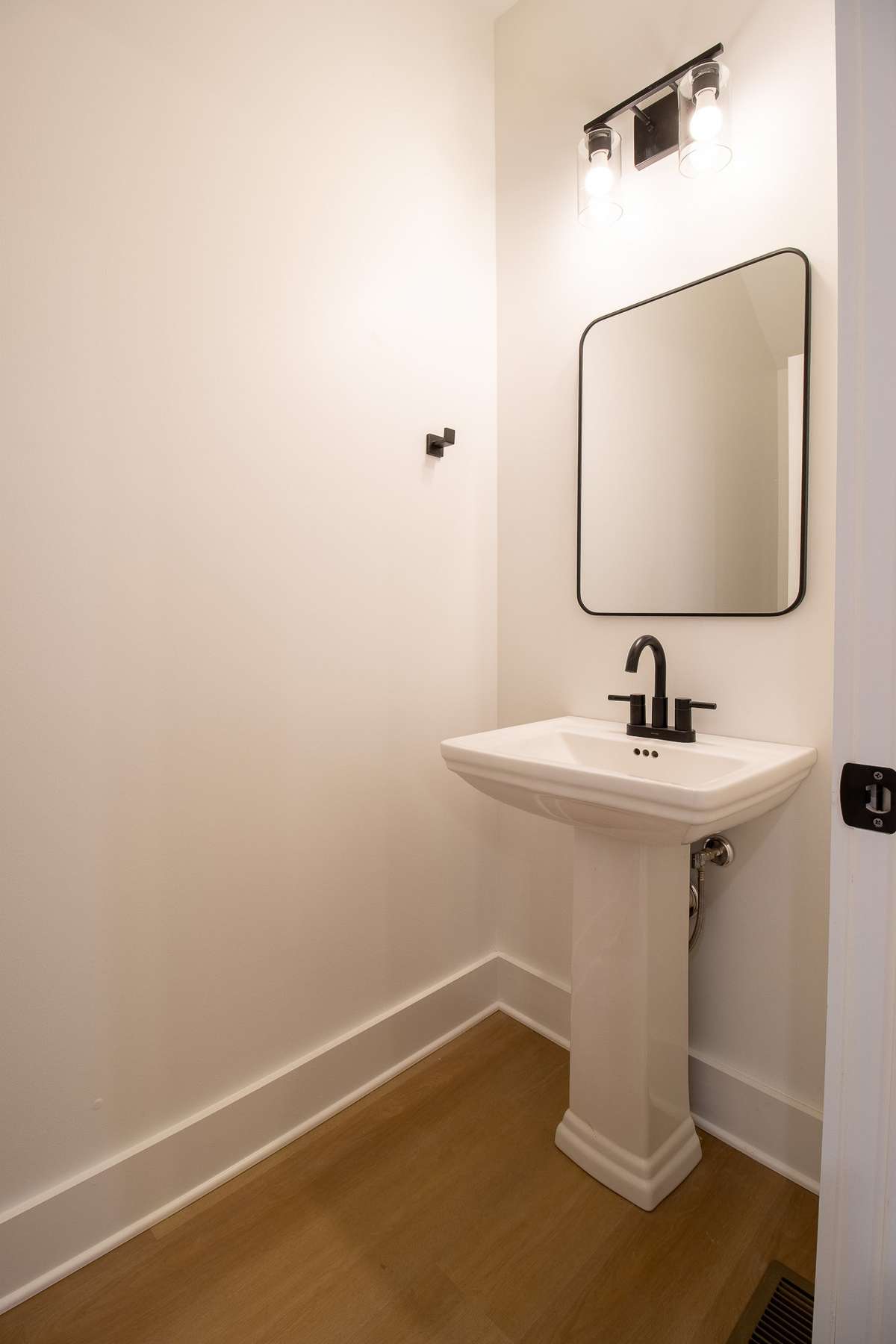 A half Bath is conveniently located across from the kitchen.