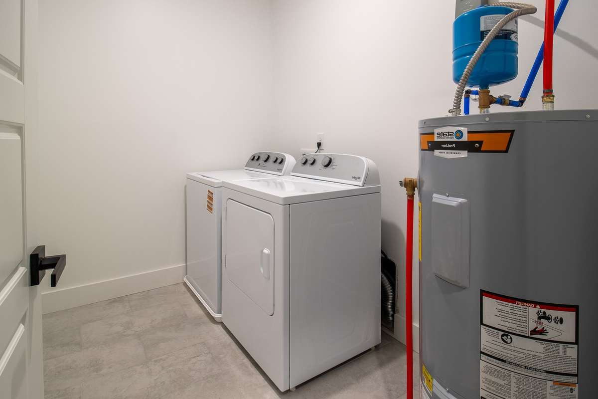 The laundry room comes fully-equipped with washer and dryer, and is conveniently located on the same level as the bedrooms.