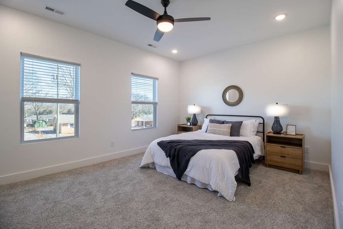 The spacious primary suite has its own en suite bathroom and walk-in closet.