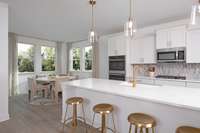 ***Photo From Winters Model Home - Options May Vary***

Double ovens and an electric cooktop, along with designer touches throughout, elevate the gourmet kitchen, making it the true heart of the home.