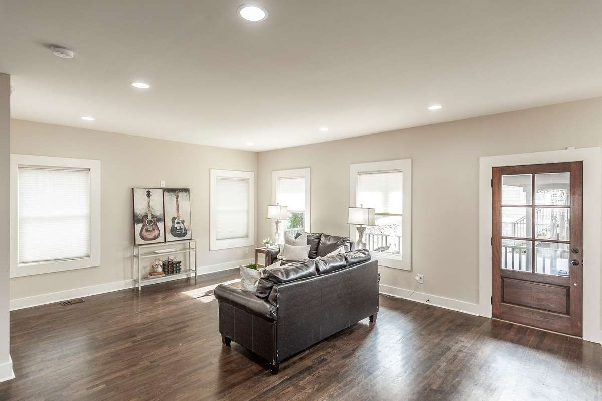 Spacious living room offers multiple layout options, making it easy to create a comfortable and functional gathering space.