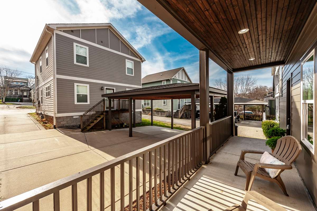 Thoughtfully designed front exterior combines practical parking, outdoor living, and fresh updates for lasting appeal.