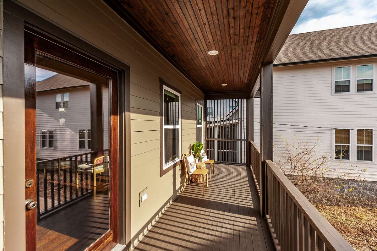 This charming deck extends the primary suite and creates a relaxing space to enjoy fresh air.