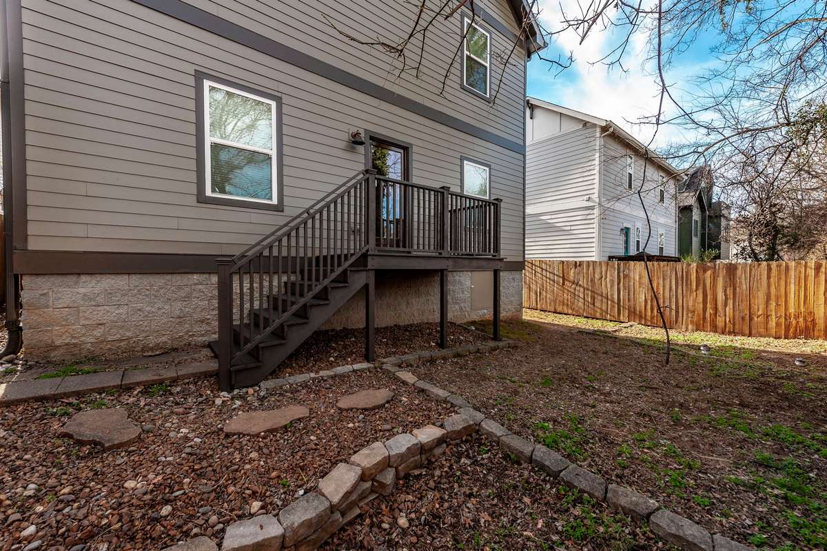 The fenced backyard provides a private outdoor space perfect for relaxing or entertaining.